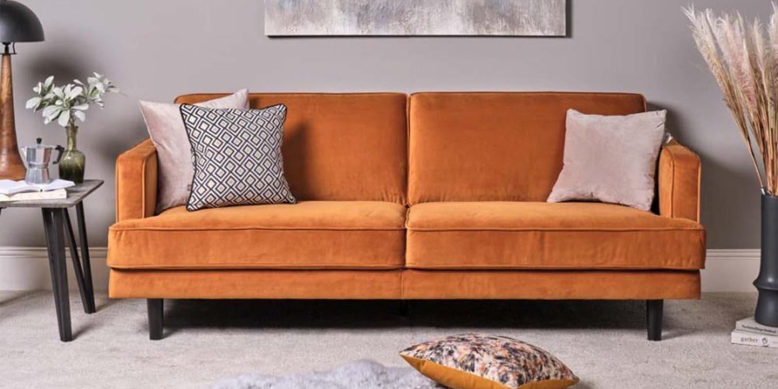 How can you make cushions look good on a colourful sofa?