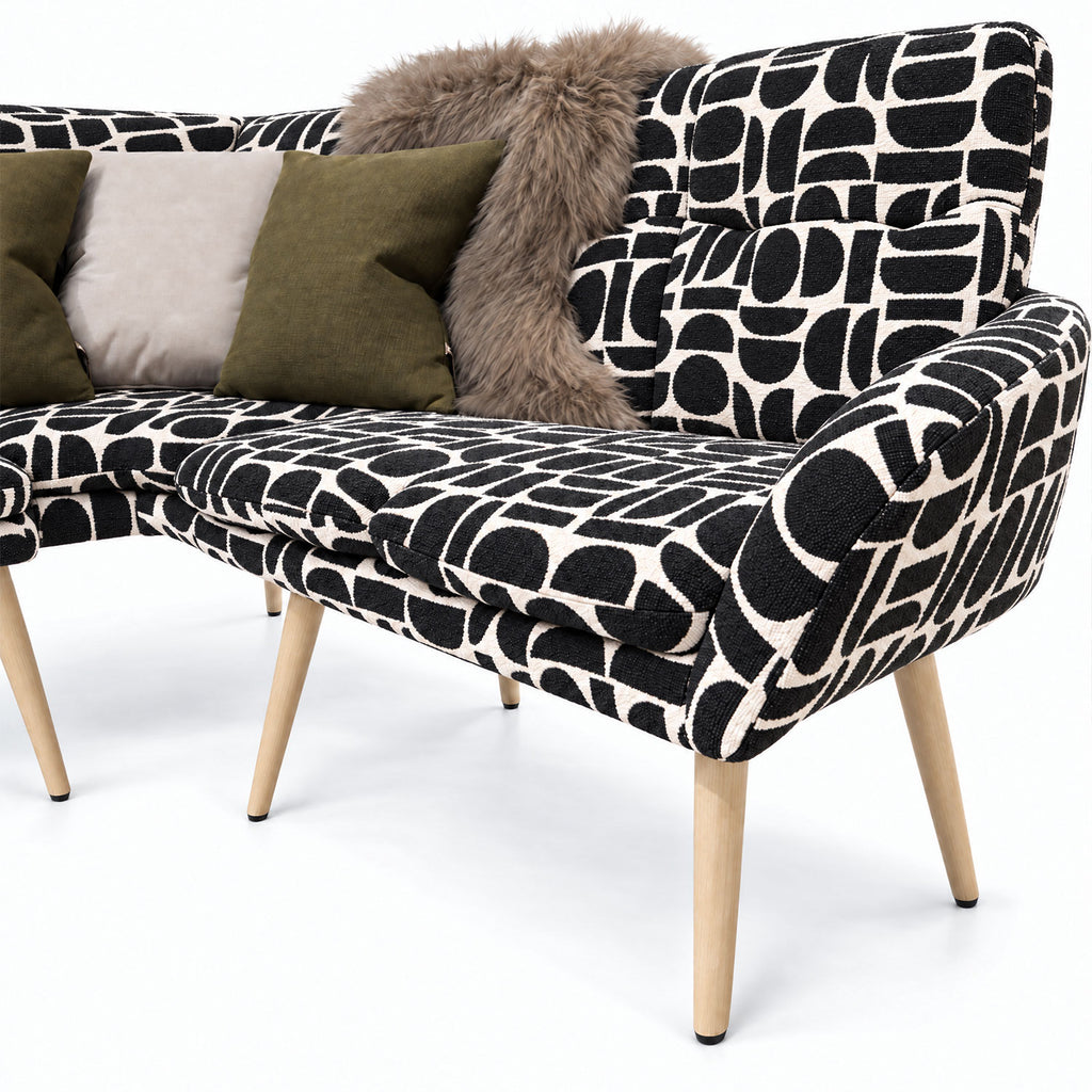 Close-up of the Sloane corner bench end seat and curved backrest in black geometric pattern fabric