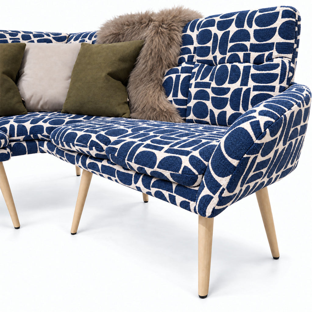 Close-up of the Sloane corner bench end seat and curved backrest in blue geometric pattern fabric