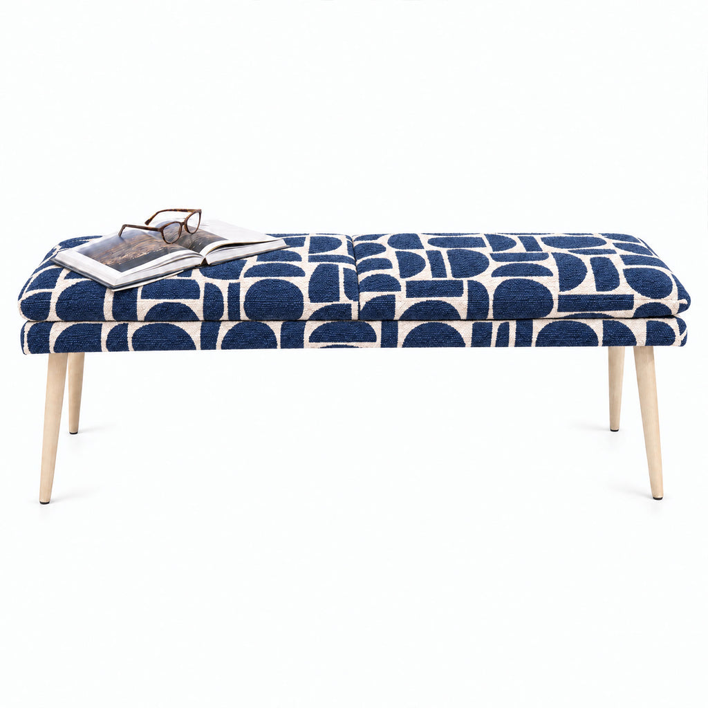 Sloane 140cm flat bench in blue geometric pattern fabric with tapered natural wooden legs, angled view