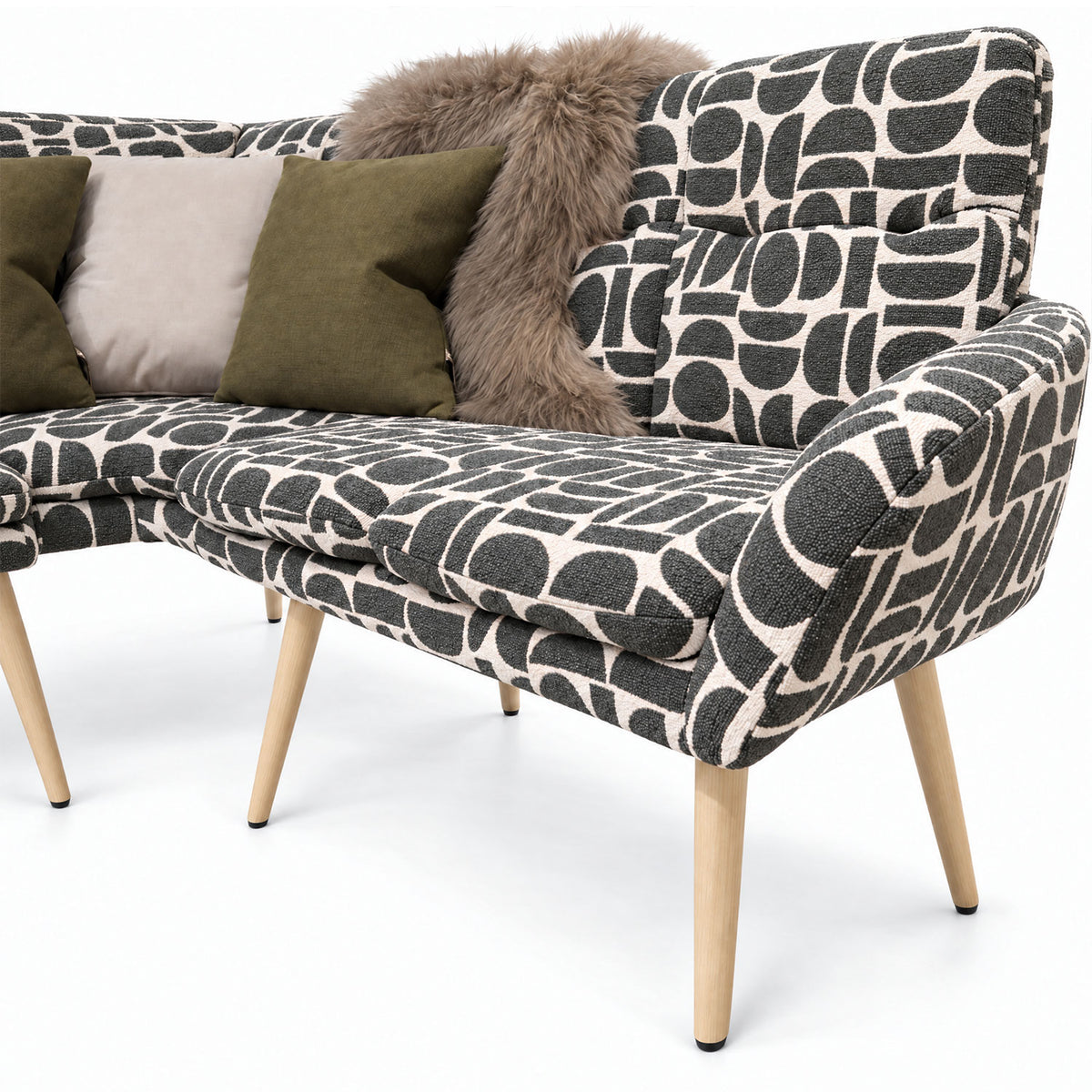Close-up of the Sloane corner bench end seat and curved backrest in sage geometric pattern fabric