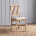 Wooden dining chair in oak finish and fabric seat.