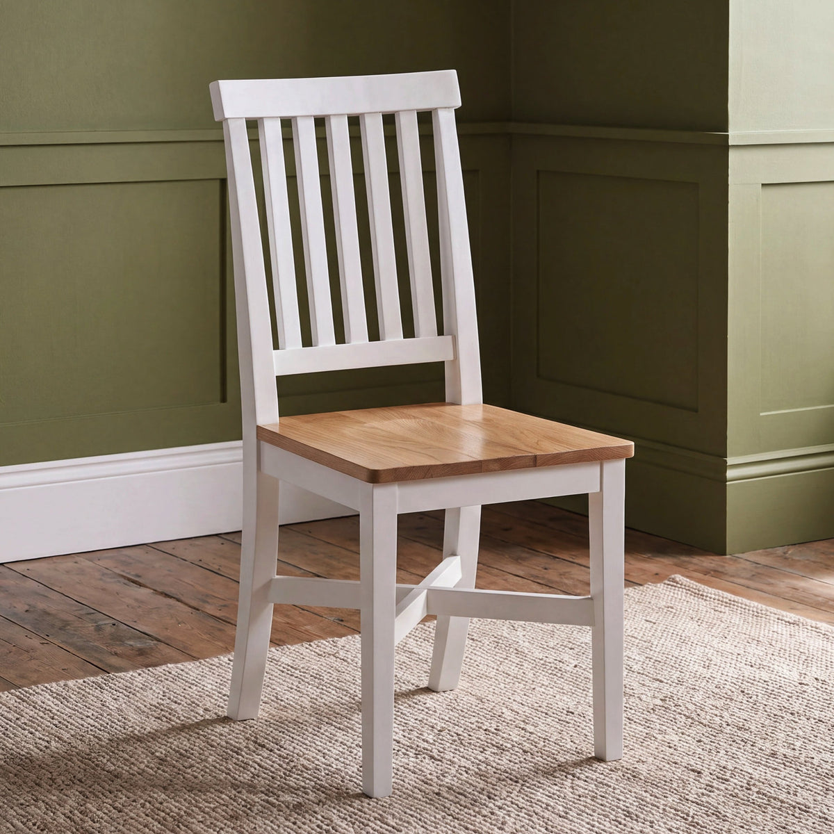Wooden dining chair with painted finish and wood finish seat.