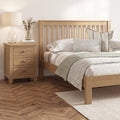 Bedframe in oak finish with slatted headboard