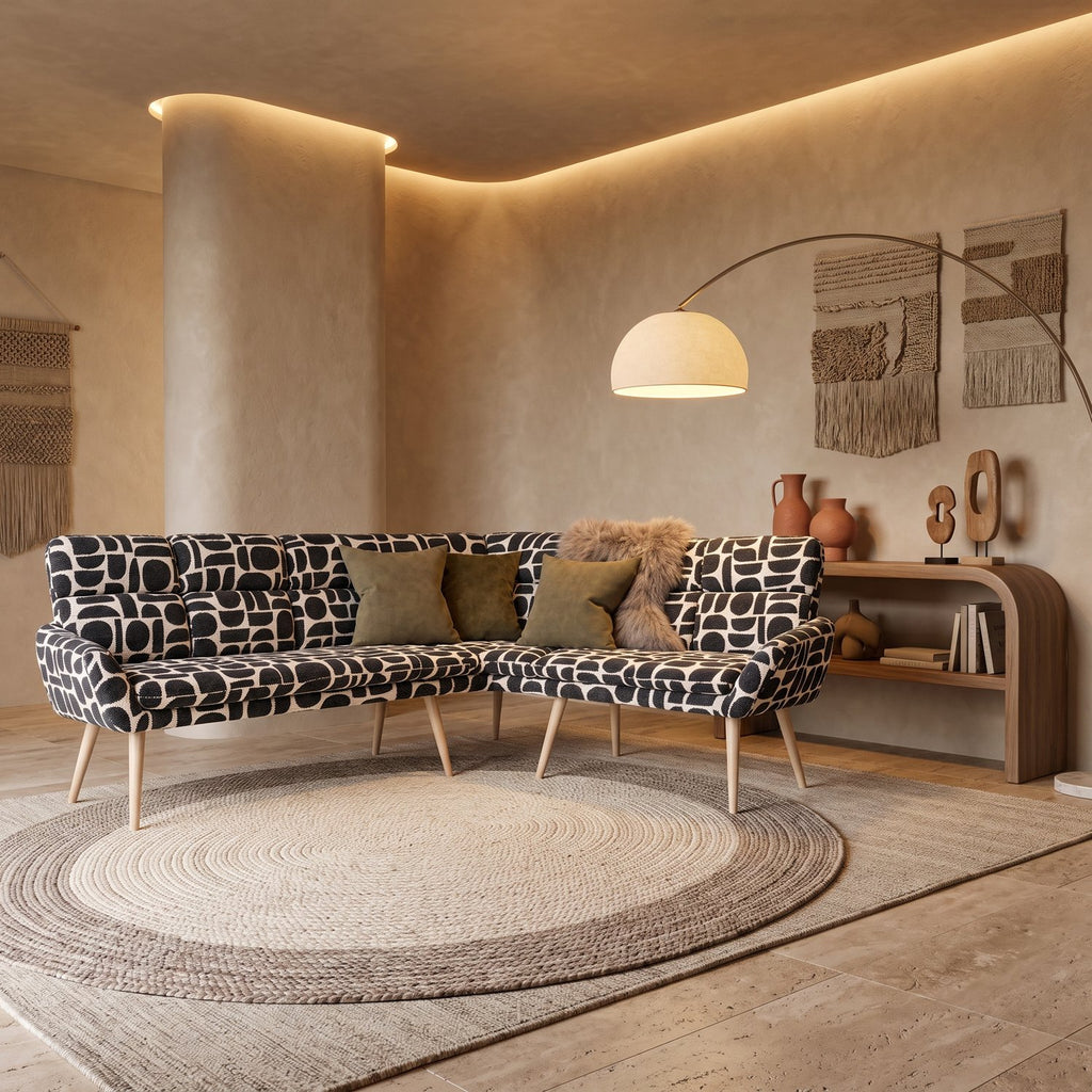 Sloane L-shaped corner bench in black and cream geometric pattern boucle style fabric on a round jute rug