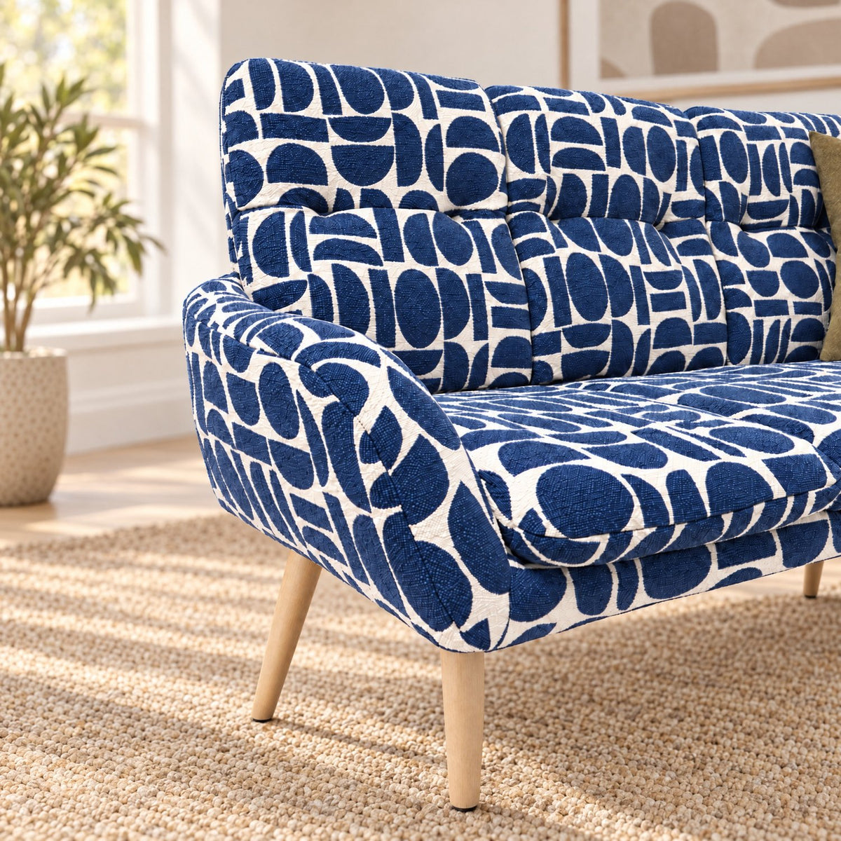 Arm and padded backrest detail of the Sloane corner bench in blue geometric pattern boucle style fabric