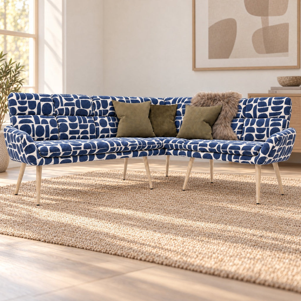 Sloane L-shaped corner bench in blue and cream geometric pattern boucle style fabric with green cushions and a faux fur throw
