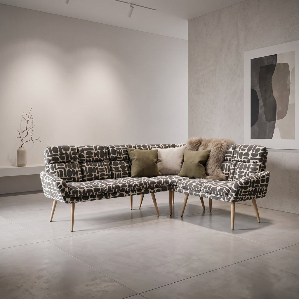 Sloane L-shaped corner bench in sage and cream geometric pattern boucle style fabric with olive cushions in a bright room