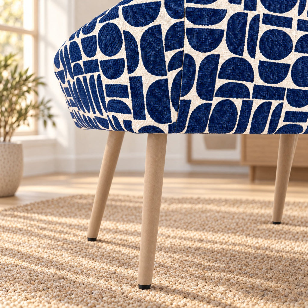 Tapered beech-wrapped metal legs on the Sloane dining chair in blue geometric pattern fabric