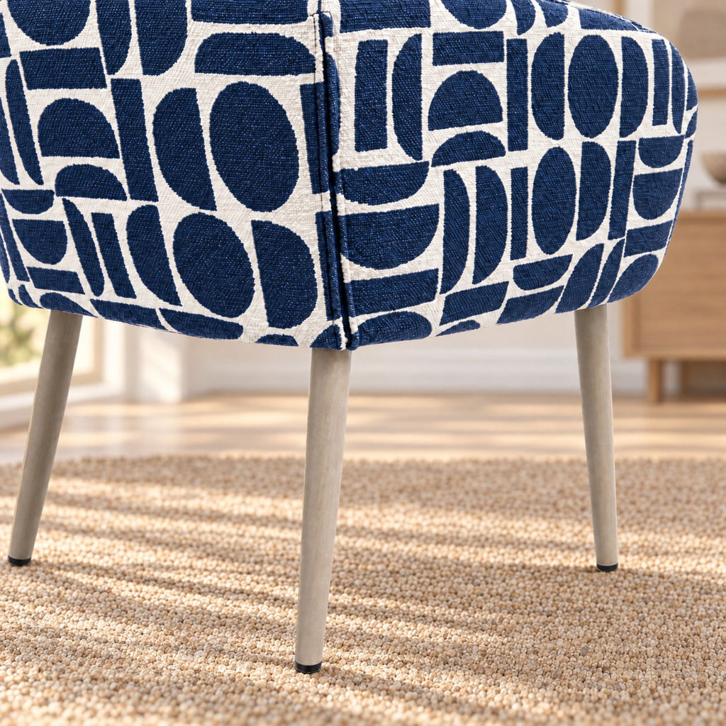 Rear view of the Sloane dining chair in blue geometric pattern boucle style fabric showing the legs