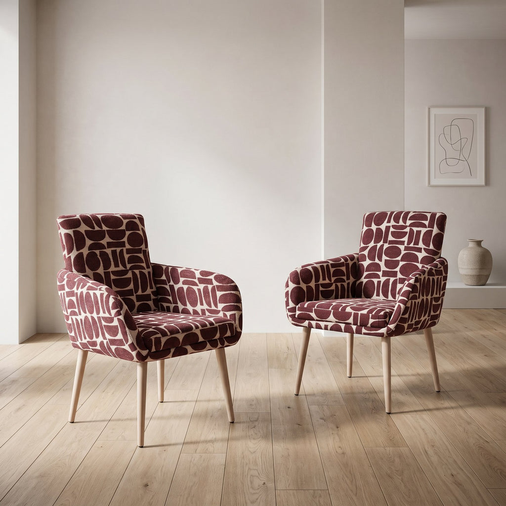 Pair of Sloane dining chairs with arms in plum and cream geometric pattern boucle style fabric on an oak floor