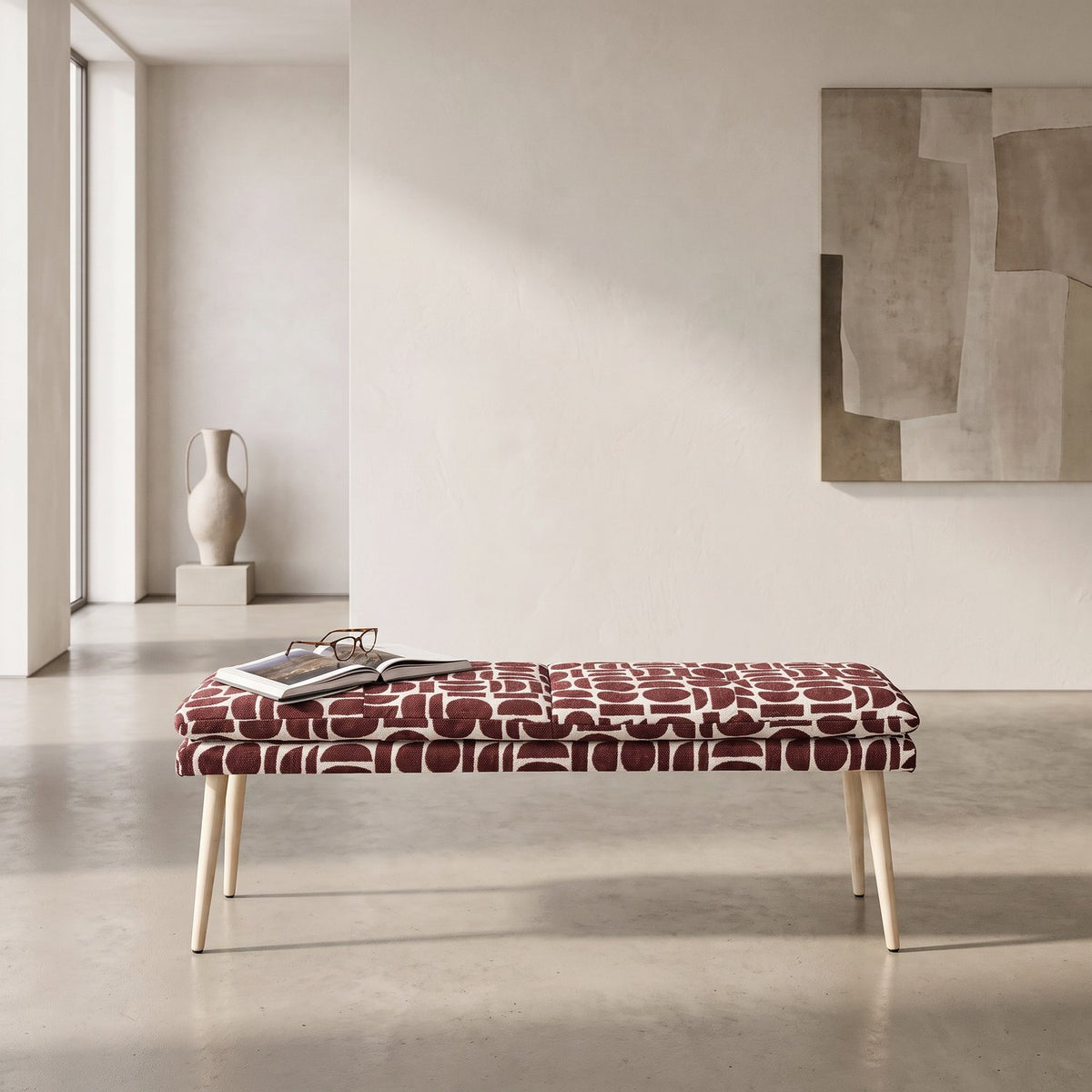 Sloane 140cm flat bench in plum and cream geometric pattern boucle style fabric on beech-wrapped metal legs in a minimalist room