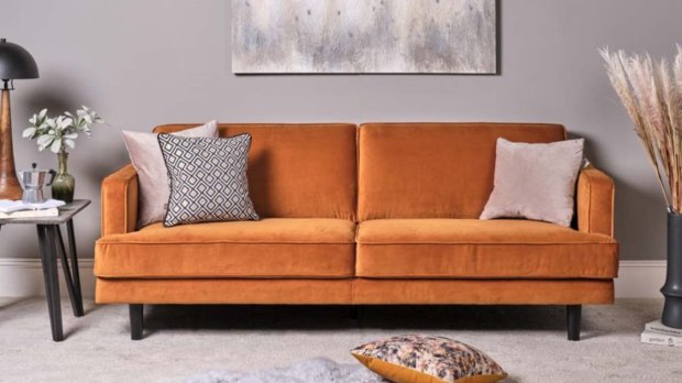 How can you make cushions look good on a colourful sofa?