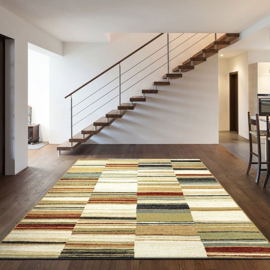An image of Woodstock Striped Multi Coloured Rug - 133cm x 195cm