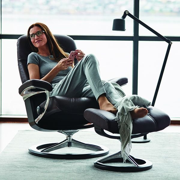 An image of Stressless Consul Recliner With Signature Base and Footstool - Large in Fabric